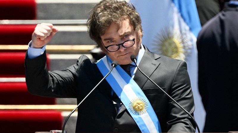 Argentina&#8217;s new president Javier Milei gestures as he delivers his inaugural speech before the crowd, during an inauguration ceremony at the Congress in Buenos Aires on December 10, 2023. Libertarian economist Javier Milei was sworn in Sunday as 
