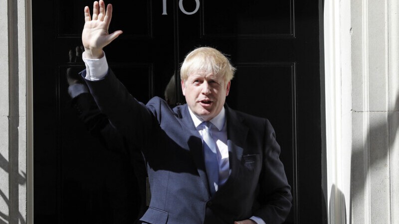 Britain&#8217;s new Prime Minister Boris Johnson waves from the steps outside 10 Downing Street, London, Wednesday, July 24, 2019. Boris Johnson has replaced Theresa May as Prime Minister, following her resignation last month after Parliament repeatedl